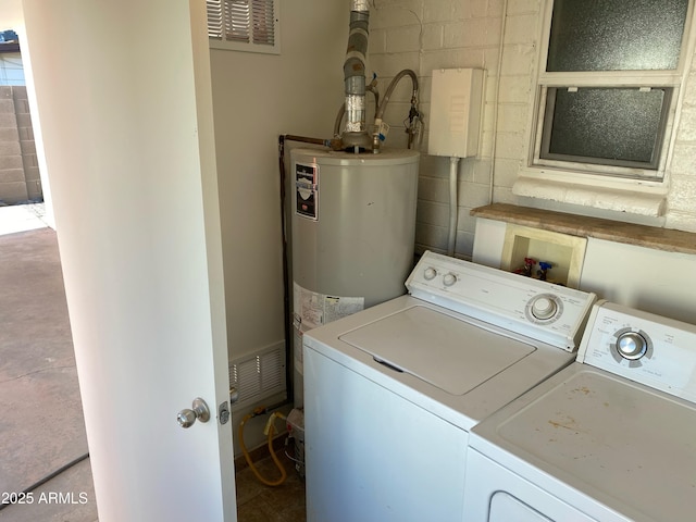 laundry area featuring independent washer and dryer and concrete block wall