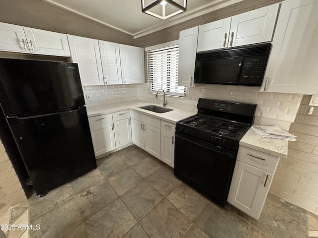 kitchen with black appliances, a sink, white cabinets, tasteful backsplash, and ornamental molding