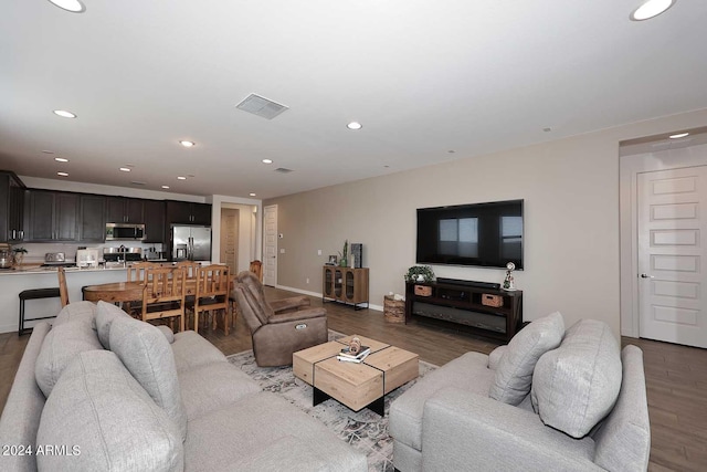 living room featuring dark hardwood / wood-style floors