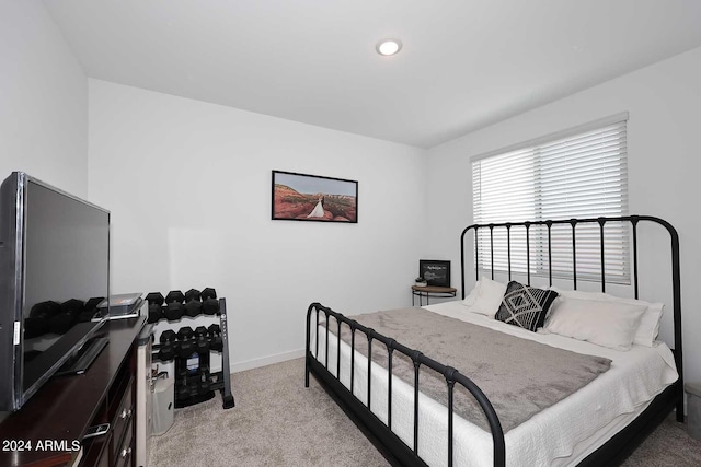 bedroom featuring light colored carpet