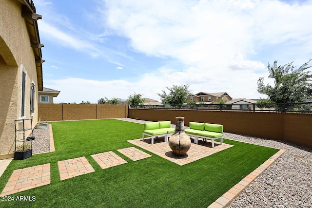 view of yard featuring a patio and outdoor lounge area