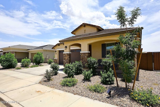 view of front of property with a garage