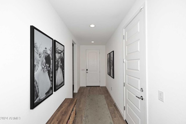 hallway with dark wood-type flooring