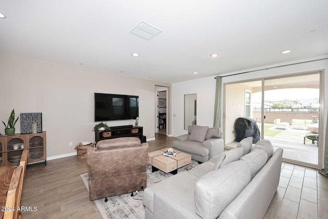 living room with light hardwood / wood-style flooring