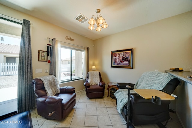 living area featuring light tile patterned floors and an inviting chandelier