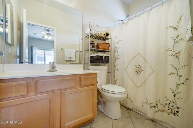 bathroom with ceiling fan, tile patterned floors, vanity, and toilet