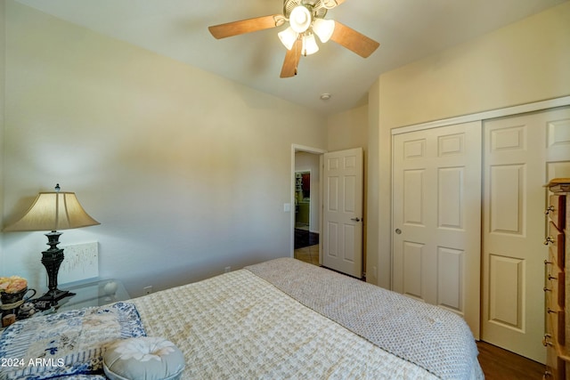 bedroom featuring a closet, ceiling fan, and dark hardwood / wood-style flooring