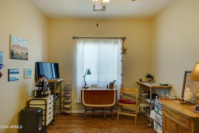 sitting room featuring dark hardwood / wood-style flooring and ceiling fan