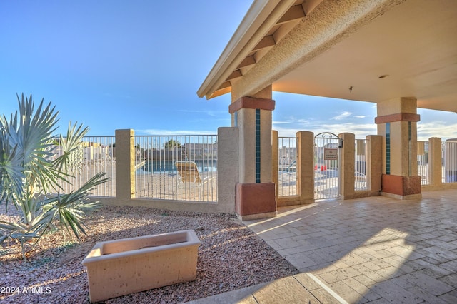 view of pool with a hot tub and a patio area