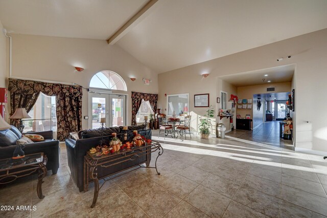 living room with beam ceiling, high vaulted ceiling, french doors, and tile patterned floors