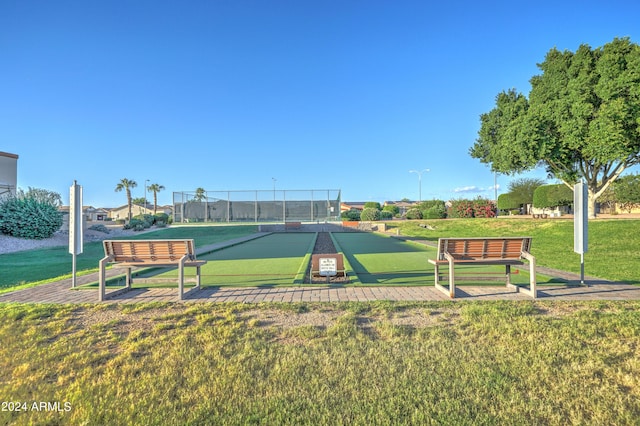 view of home's community with a yard