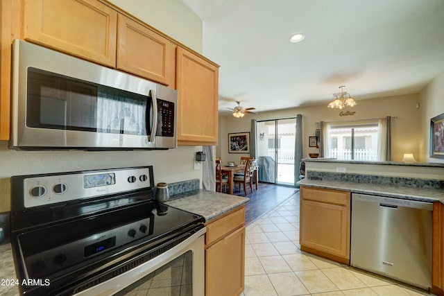 kitchen featuring appliances with stainless steel finishes, light tile patterned flooring, light brown cabinetry, and ceiling fan with notable chandelier