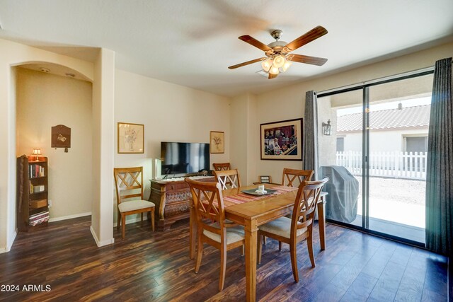 dining area featuring ceiling fan and dark wood-type flooring