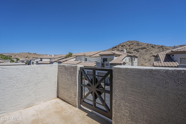 3236 E Chandler Blvd Unit 2003, Phoenix, AZ 85048 - view of patio with a balcony, a mountain view, and a residential view