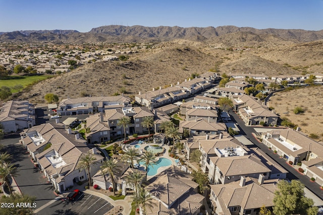 3236 E Chandler Blvd Unit 2003, Phoenix, AZ 85048 - aerial view of property's location with a mountain backdrop, nearby suburban area, and a pool