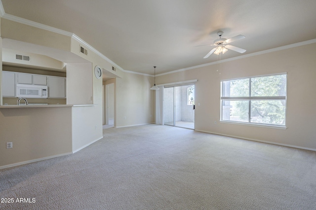 3236 E Chandler Blvd Unit 2003, Phoenix, AZ 85048 - unfurnished living room with ceiling fan, ornamental molding, baseboards, light colored carpet, and a sink