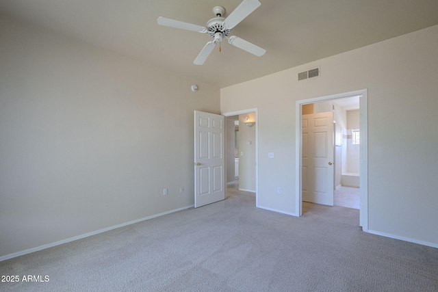 3236 E Chandler Blvd Unit 2003, Phoenix, AZ 85048 - unfurnished bedroom featuring light colored carpet, baseboards, ensuite bath, and ceiling fan