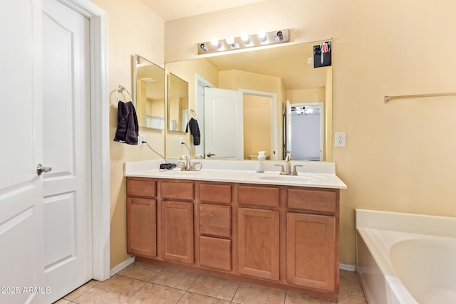 1619 E Aspen Ave, Buckeye, AZ 85326 - full bath with double vanity, a garden tub, and tile patterned floors