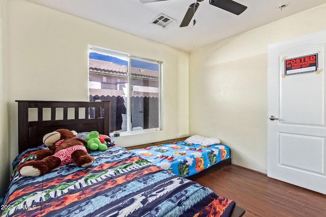 1619 E Aspen Ave, Buckeye, AZ 85326 - bedroom with wood finished floors and ceiling fan