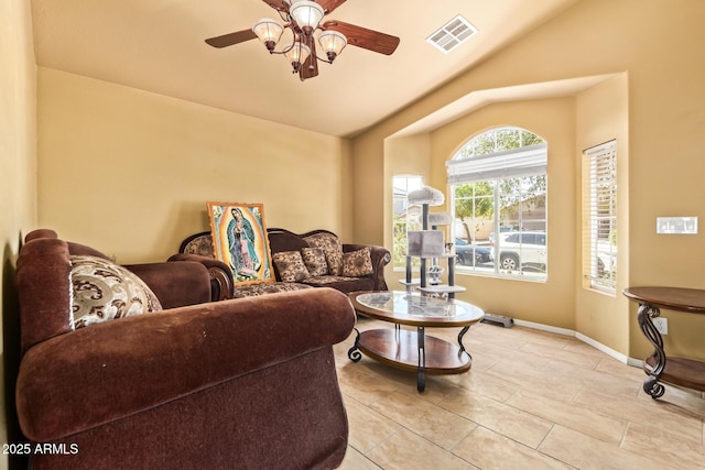 1619 E Aspen Ave, Buckeye, AZ 85326 - living room featuring vaulted ceiling, a ceiling fan, and light tile patterned floors