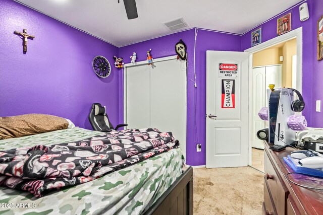 1619 E Aspen Ave, Buckeye, AZ 85326 - bedroom featuring light colored carpet, a closet, and ceiling fan