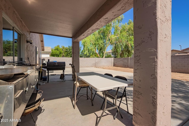 1619 E Aspen Ave, Buckeye, AZ 85326 - fenced backyard with a patio and grilling area