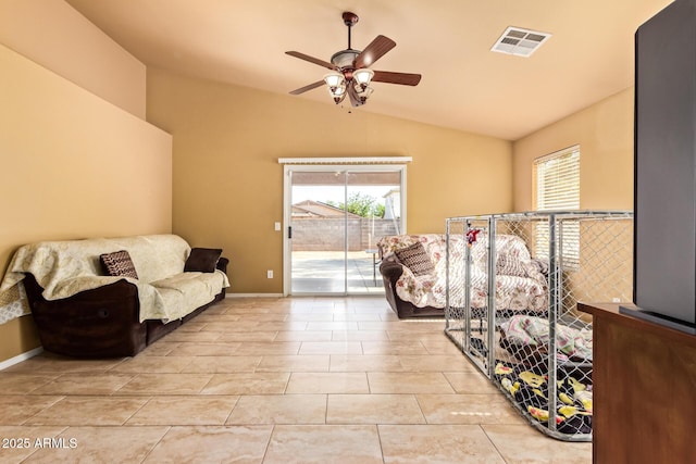 1619 E Aspen Ave, Buckeye, AZ 85326 - living area with vaulted ceiling, ceiling fan, and light tile patterned floors