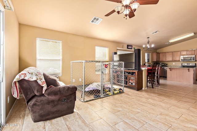 1619 E Aspen Ave, Buckeye, AZ 85326 - sitting room featuring plenty of natural light, ceiling fan, a chandelier, and lofted ceiling