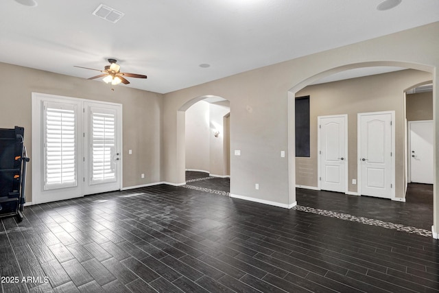 unfurnished living room featuring ceiling fan