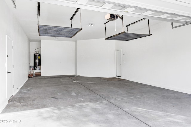 garage featuring a garage door opener and electric water heater