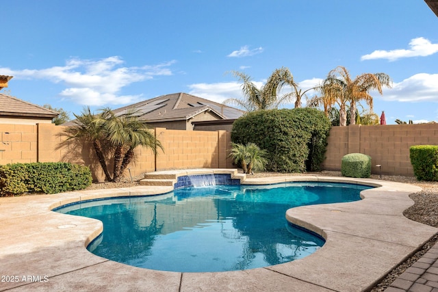 view of swimming pool with pool water feature and a patio