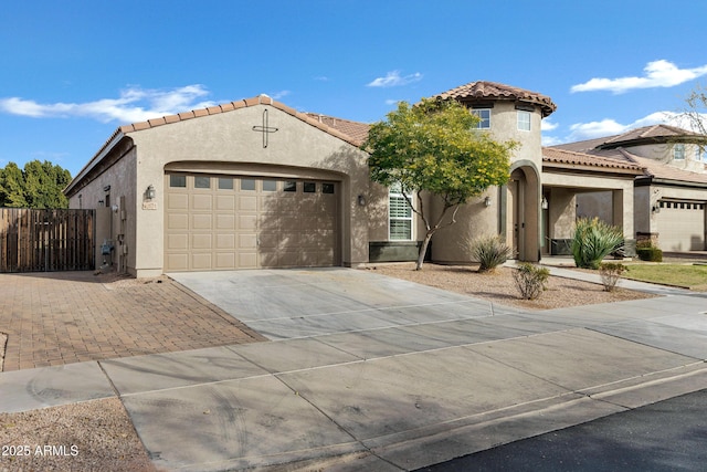 mediterranean / spanish-style house featuring a garage