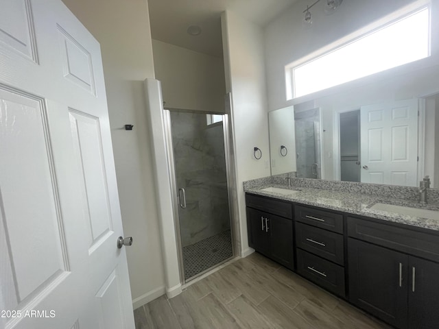 1825 Via Nueva Zelandia, Rio Rico, AZ 85648 - full bathroom with a stall shower, double vanity, and baseboards