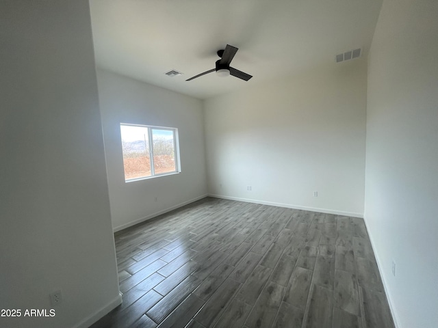 1825 Via Nueva Zelandia, Rio Rico, AZ 85648 - unfurnished room featuring dark wood finished floors, baseboards, and ceiling fan