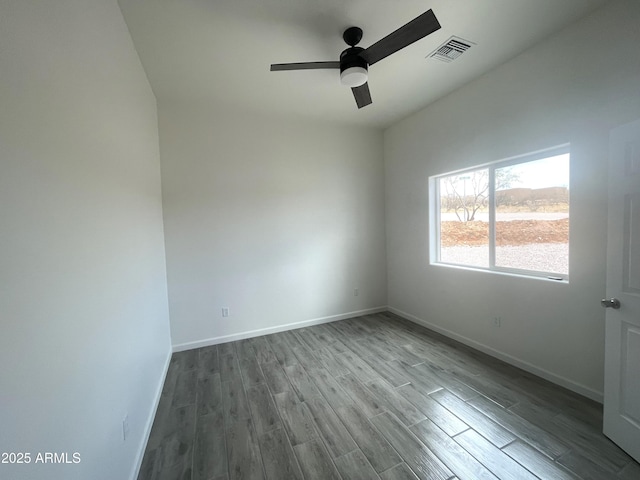 1825 Via Nueva Zelandia, Rio Rico, AZ 85648 - unfurnished room featuring a ceiling fan, wood finished floors, and baseboards