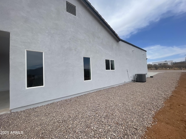 1825 Via Nueva Zelandia, Rio Rico, AZ 85648 - view of home's exterior featuring cooling unit and stucco siding