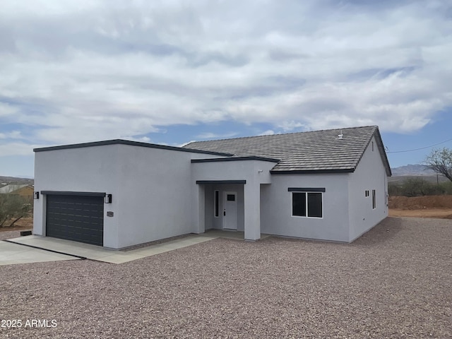 1825 Via Nueva Zelandia, Rio Rico, AZ 85648 - view of front of house with a garage, concrete driveway, and stucco siding