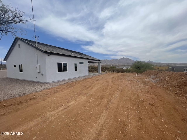 1825 Via Nueva Zelandia, Rio Rico, AZ 85648 - rear view of property featuring a mountain view and stucco siding