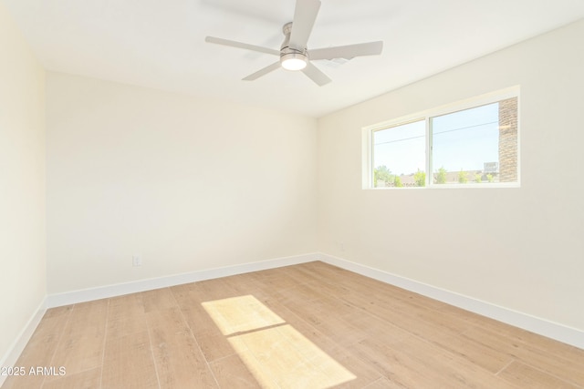 unfurnished room with ceiling fan and light hardwood / wood-style flooring