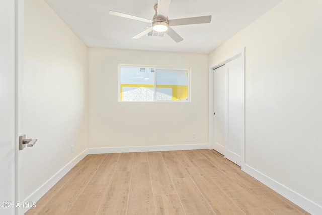 unfurnished room featuring light hardwood / wood-style flooring and ceiling fan