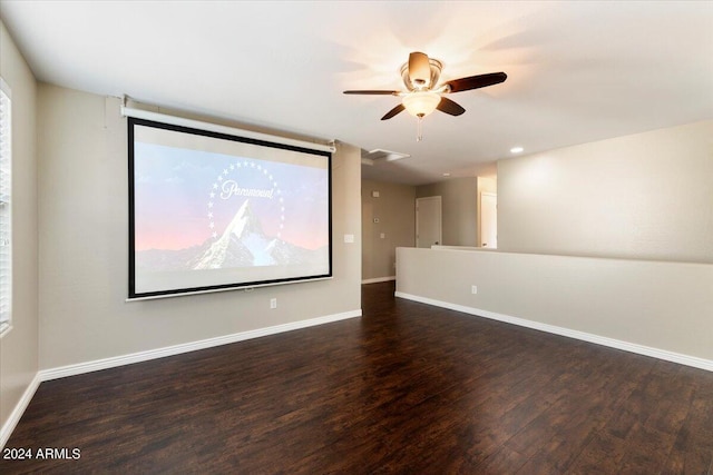 empty room with ceiling fan and dark hardwood / wood-style flooring