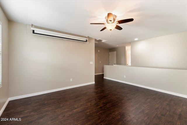 empty room featuring ceiling fan and dark wood-type flooring