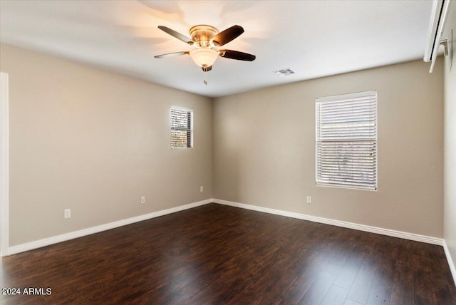 empty room featuring dark hardwood / wood-style floors and ceiling fan