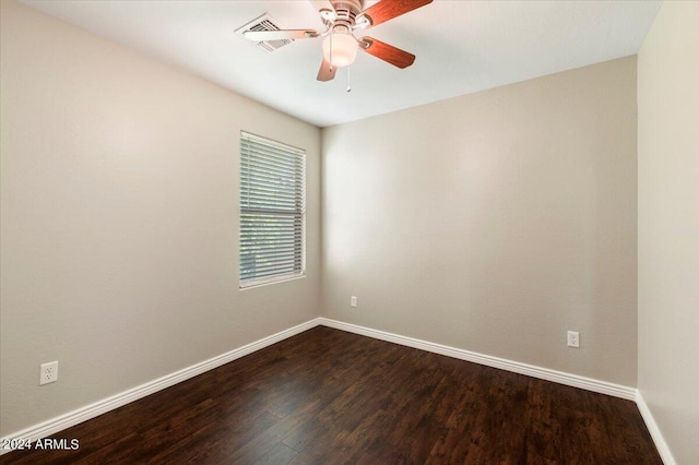 empty room with ceiling fan and hardwood / wood-style floors