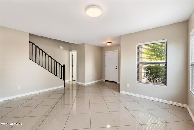 interior space featuring light tile patterned floors