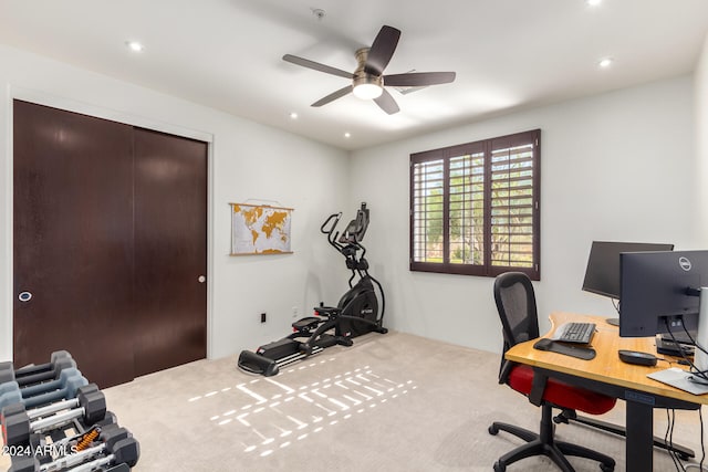 office space with light colored carpet and ceiling fan