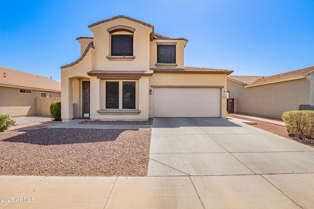 6505 S 15th Dr, Phoenix, AZ 85041 - mediterranean / spanish house with concrete driveway, stucco siding, a tile roof, and fence
