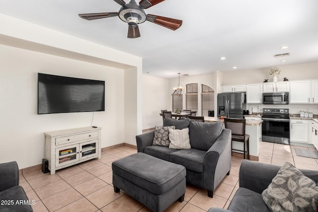 6505 S 15th Dr, Phoenix, AZ 85041 - living area with light tile patterned flooring, a chandelier, ceiling fan, and recessed lighting