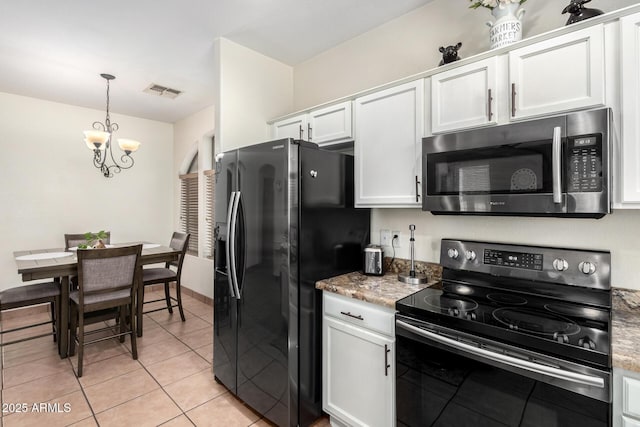 6505 S 15th Dr, Phoenix, AZ 85041 - kitchen with black appliances, white cabinetry, a chandelier, hanging light fixtures, and light tile patterned floors