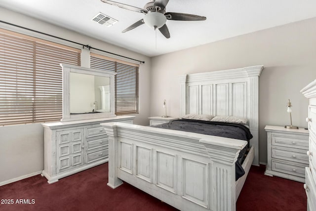 6505 S 15th Dr, Phoenix, AZ 85041 - bedroom with dark carpet, a ceiling fan, and baseboards